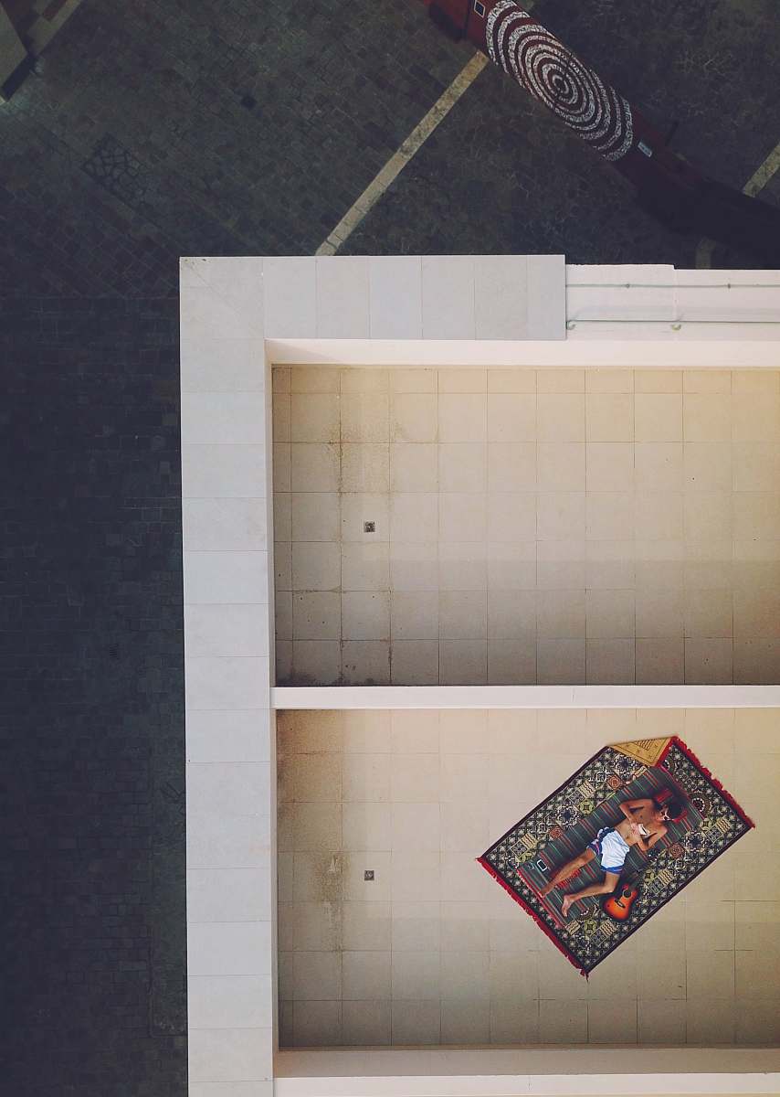 saudi arabia bird's eye view of person resting on rug blanket